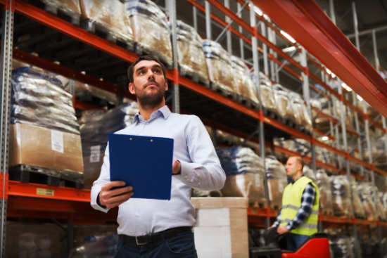 Man inspecting Warehouse inventory